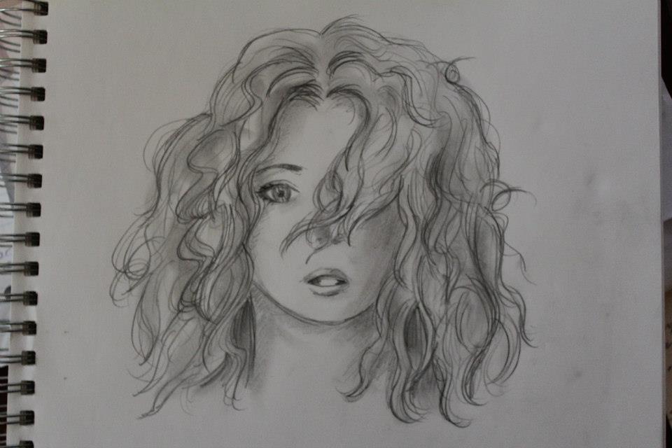 Sketch of a beautiful girl with long curly hair